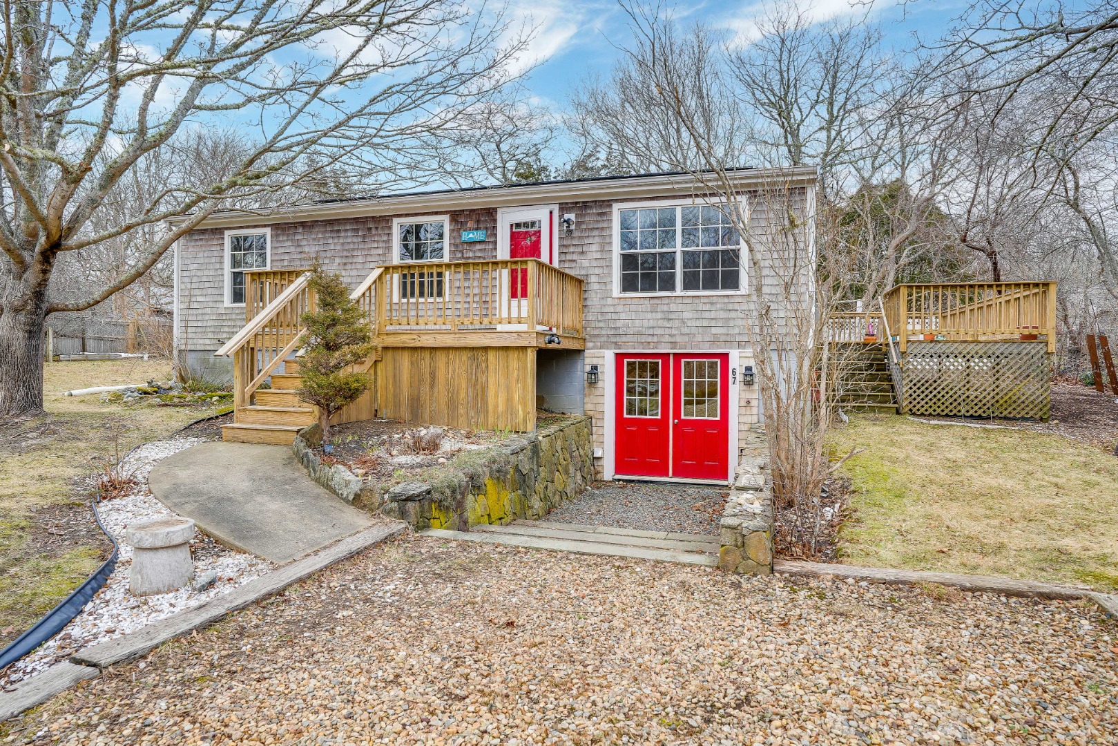 67 12th Street Edgartown, MA 02539 - Photo 4 of 26 a front view of a house with a yard