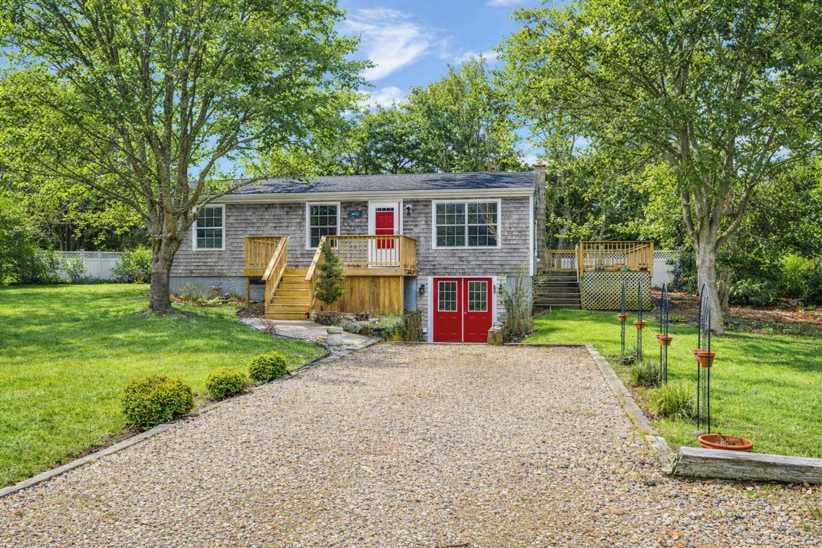67 12th Street Edgartown, MA 02539 - Photo 5 of 26 front view of a house with a yard
