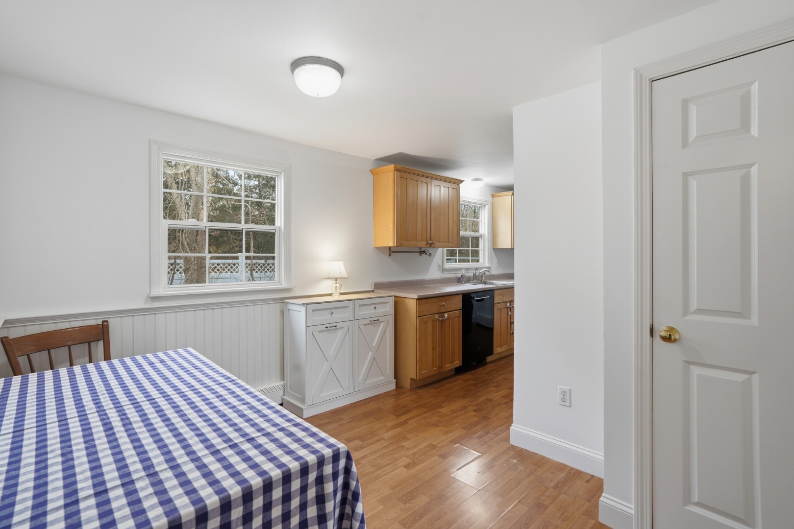 67 12th Street Edgartown, MA 02539 - Photo 7 of 26 a kitchen with a sink cabinets and wooden floor