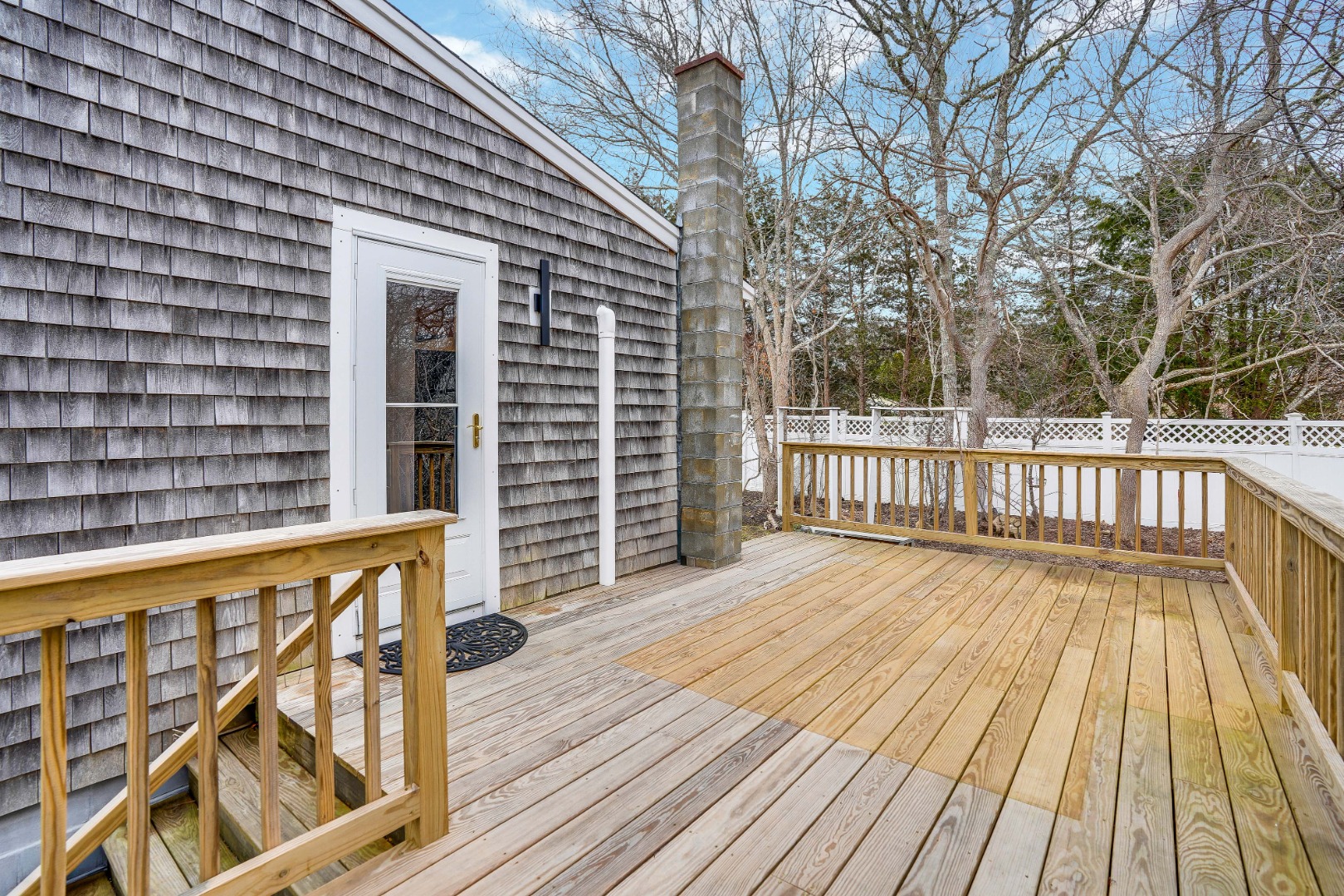67 12th Street Edgartown, MA 02539 - Photo 9 of 26 a view of a wooden deck with a yard
