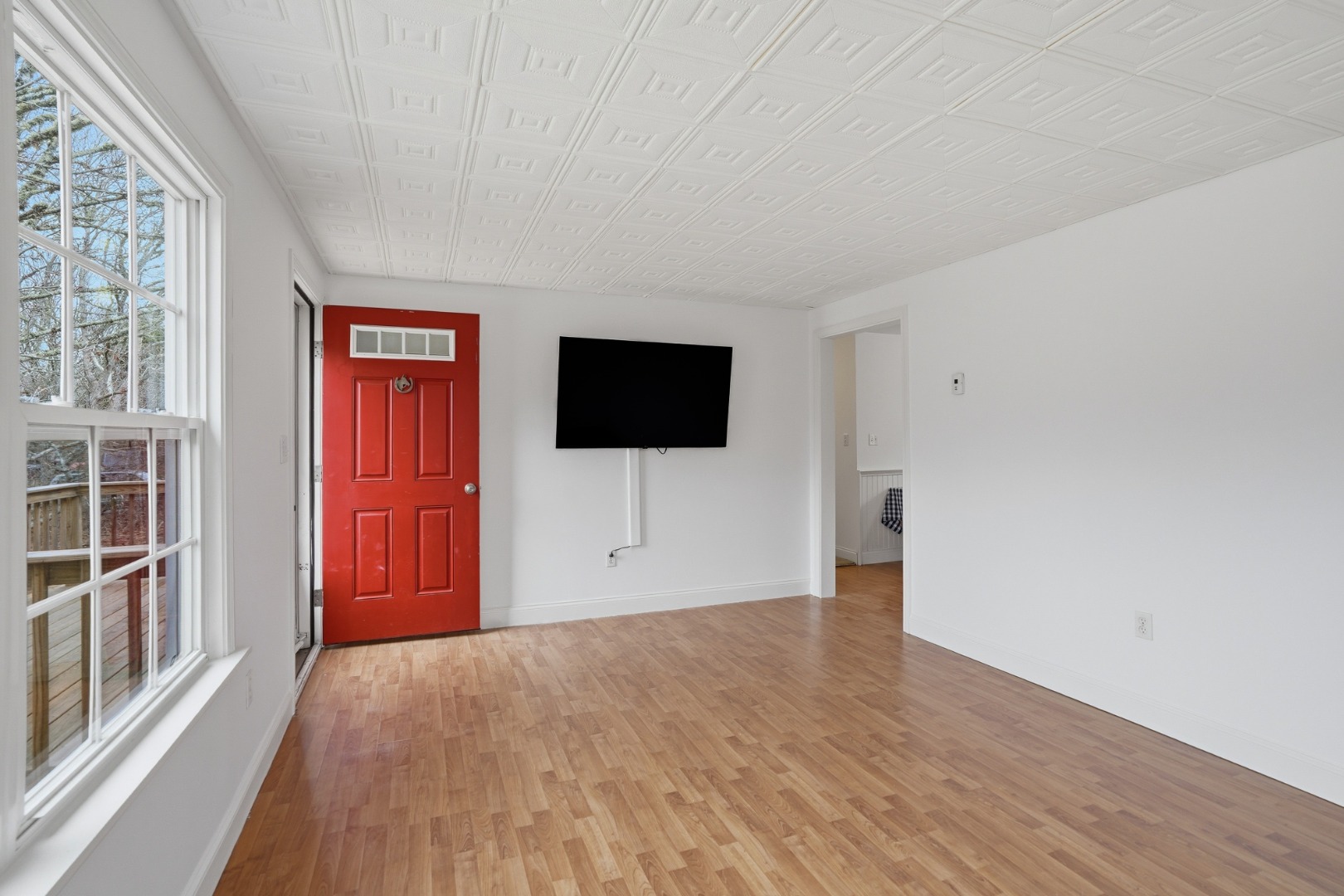67 12th Street Edgartown, MA 02539 - Photo 10 of 26 a view of a livingroom with a flat screen tv