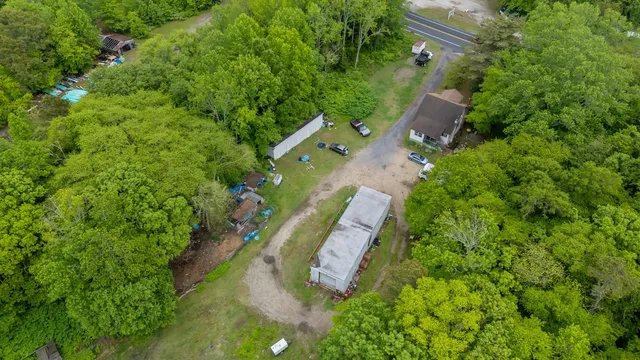 a aerial view of a house with garden space and street view