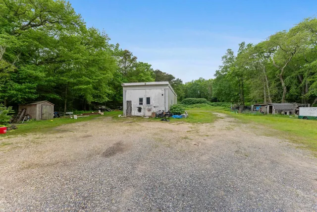 a front view of a house with a yard and a fence