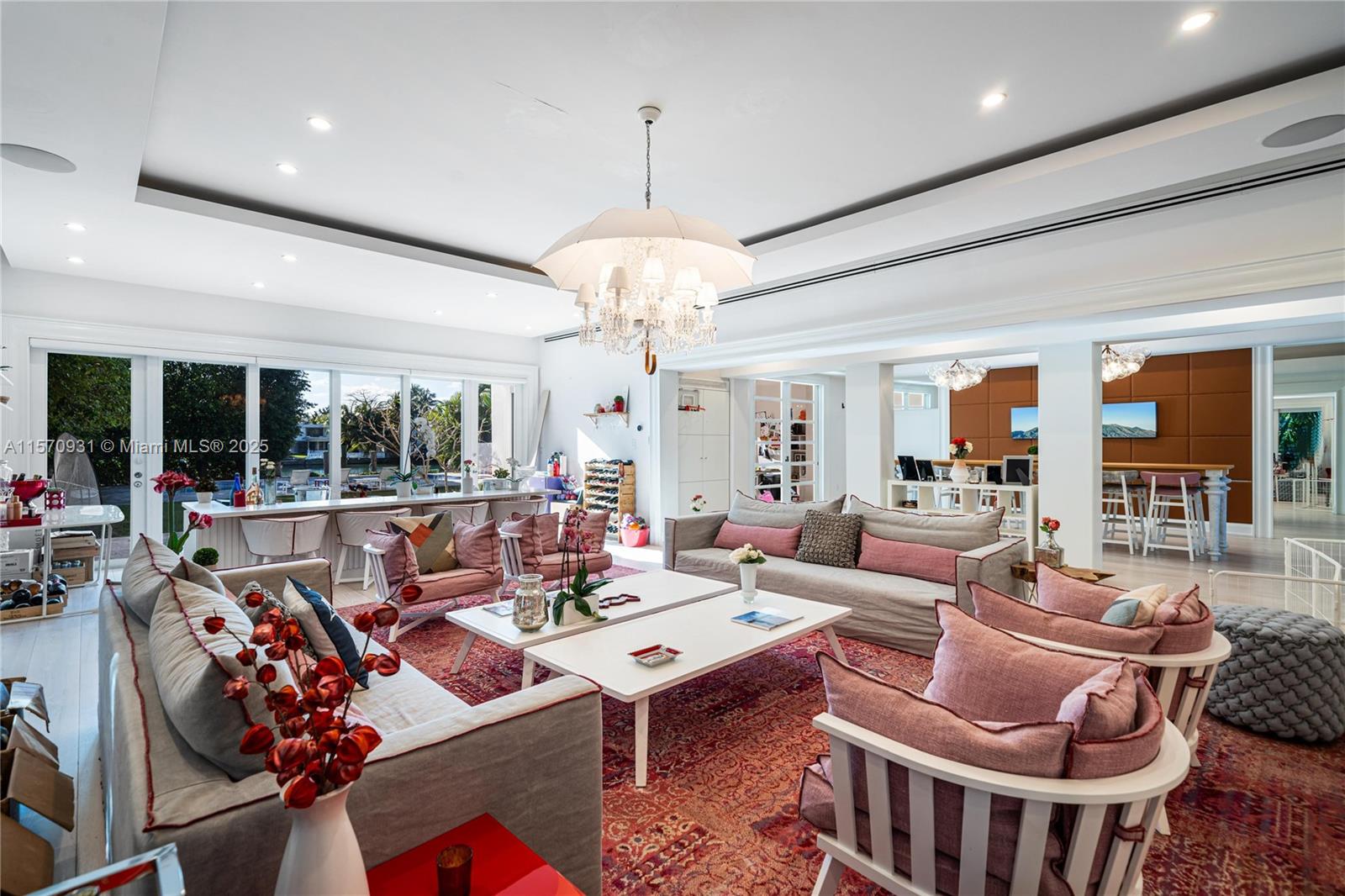 6320 Allison Road Miami Beach, FL 33141 - Photo 25 of 60 a living room with furniture chandelier and a large window