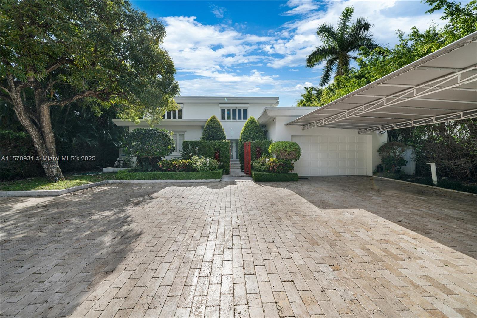 6320 Allison Road Miami Beach, FL 33141 - Photo 58 of 60 a view of a house with a yard and potted plants