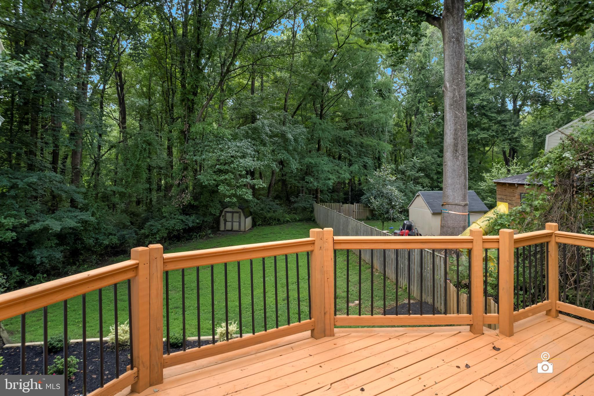 10506 Marbury Road Oakton, VA 22124 - Photo 3 of 3 a balcony with wooden floor and wooden fence