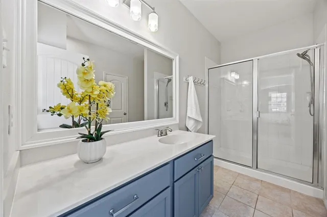a bathroom with a sink a vanity and a mirror