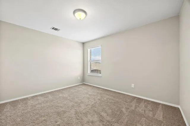 an empty room with a empty space and window