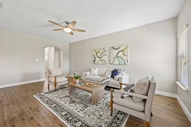a living room with furniture and a rug