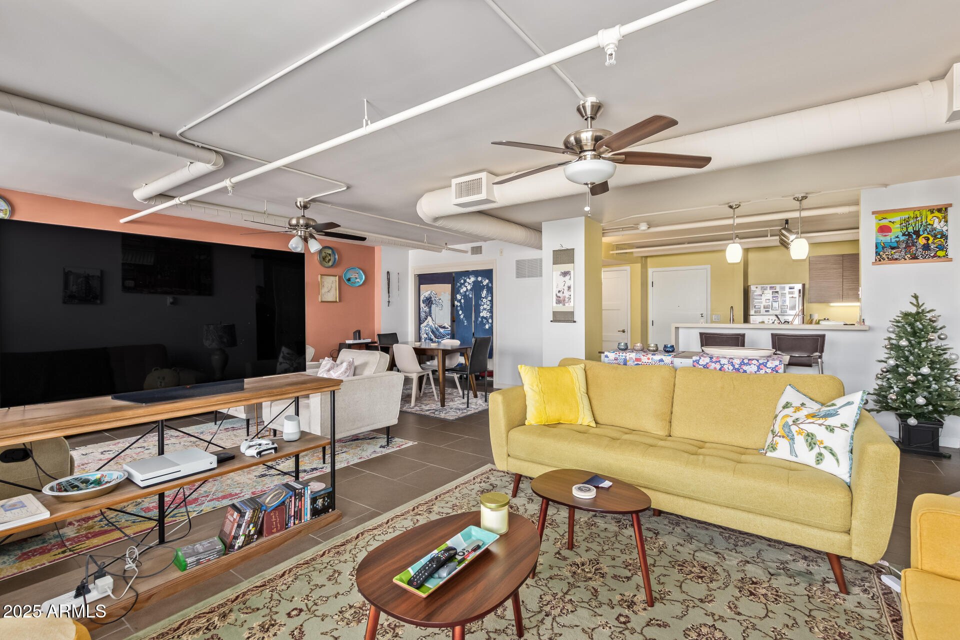 535 West Thomas Road, Unit 313 Phoenix, AZ 85013 - Photo 12 of 31 a living room with patio furniture and a flat screen tv