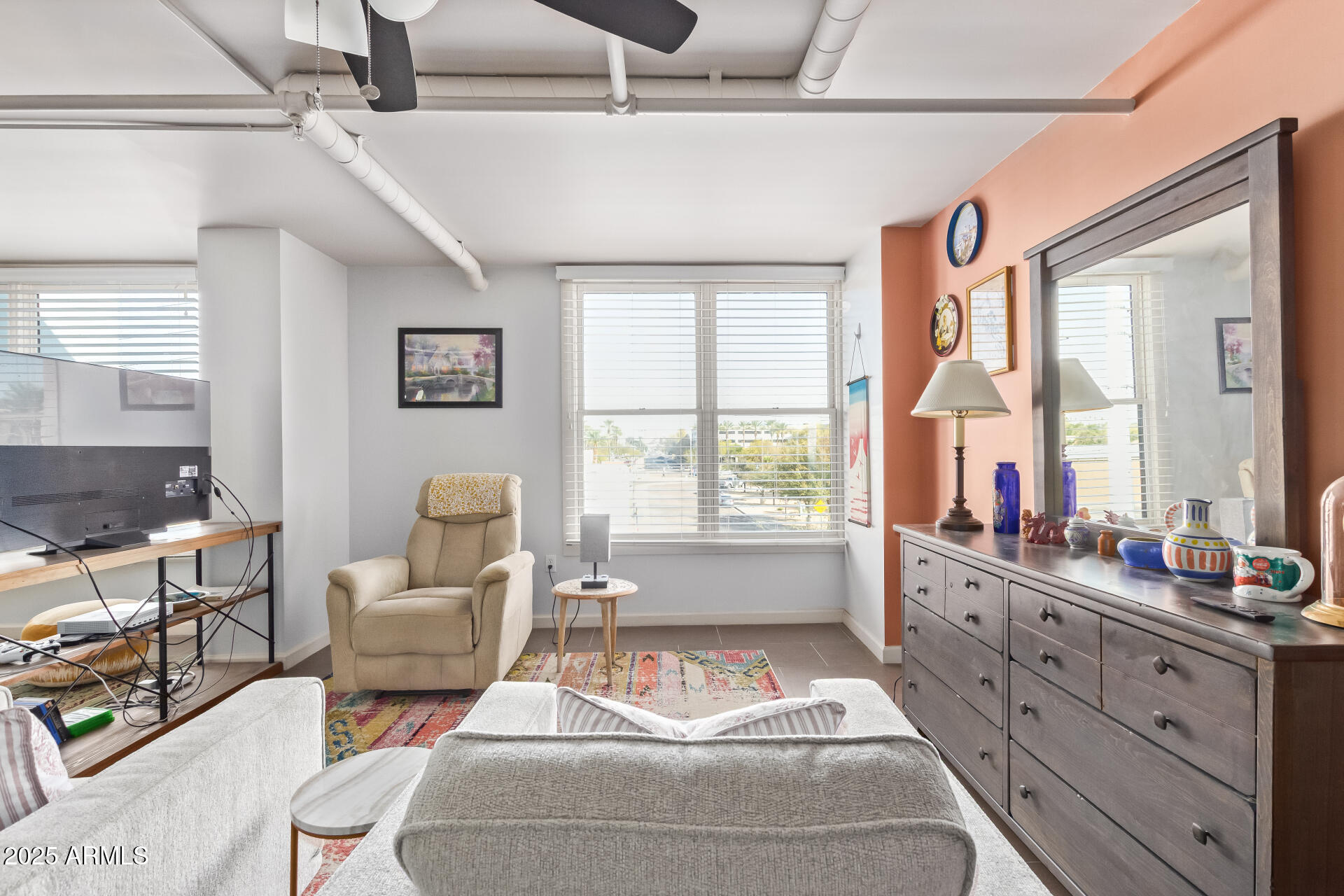 535 West Thomas Road, Unit 313 Phoenix, AZ 85013 - Photo 14 of 31 a living room with furniture and windows