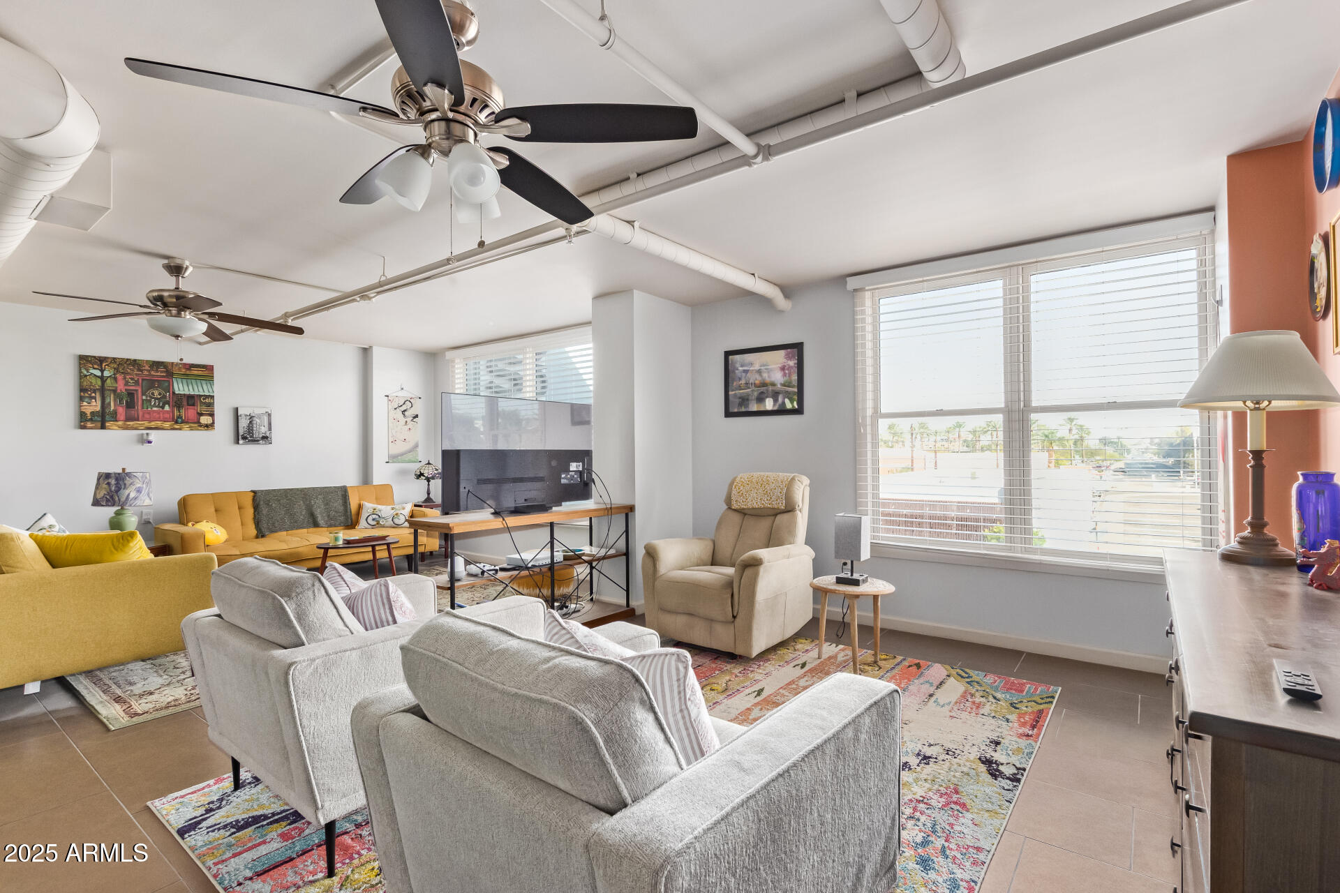 535 West Thomas Road, Unit 313 Phoenix, AZ 85013 - Photo 15 of 31 a living room with furniture and a window