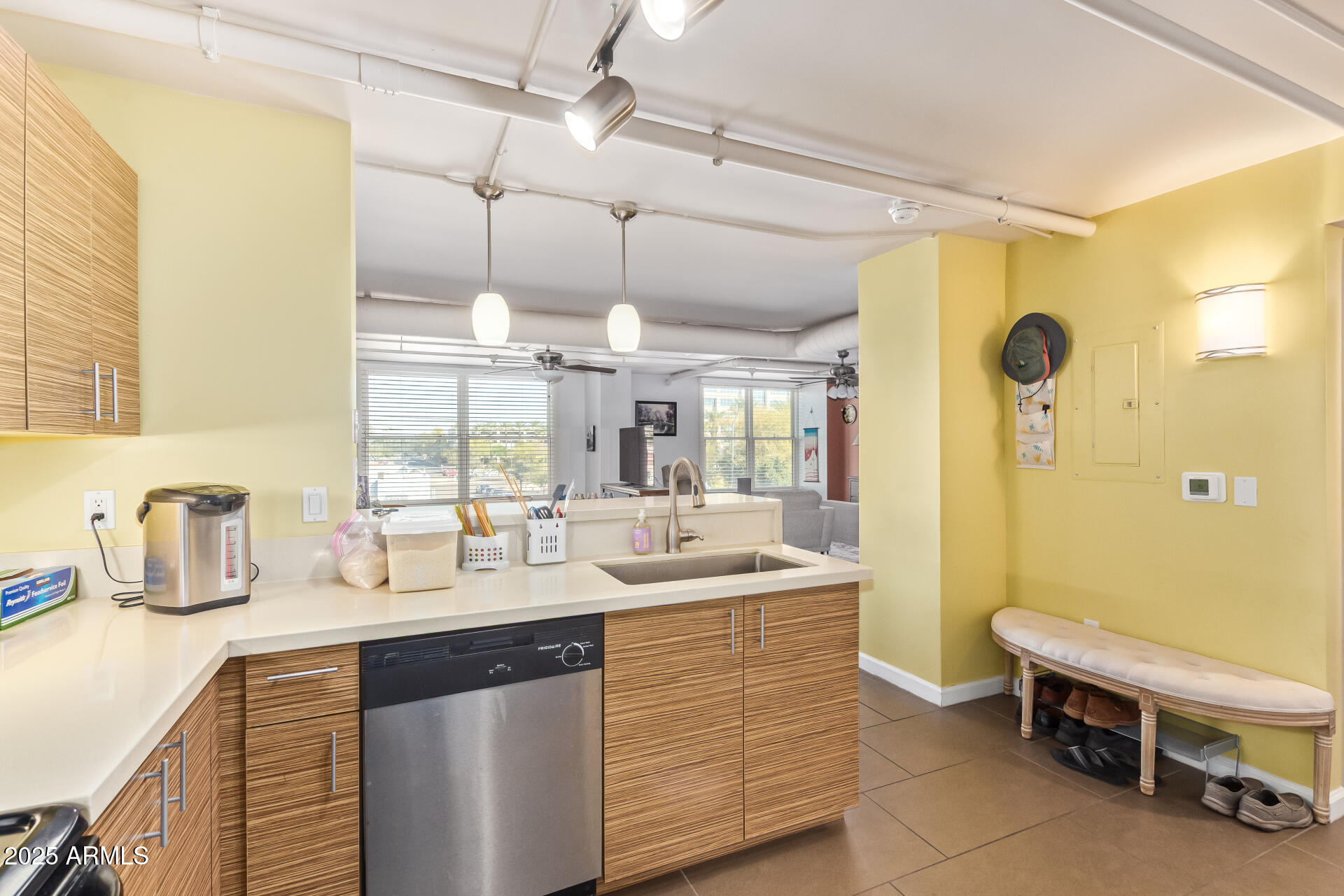 535 West Thomas Road, Unit 313 Phoenix, AZ 85013 - Photo 22 of 31 a kitchen with a sink and a refrigerator