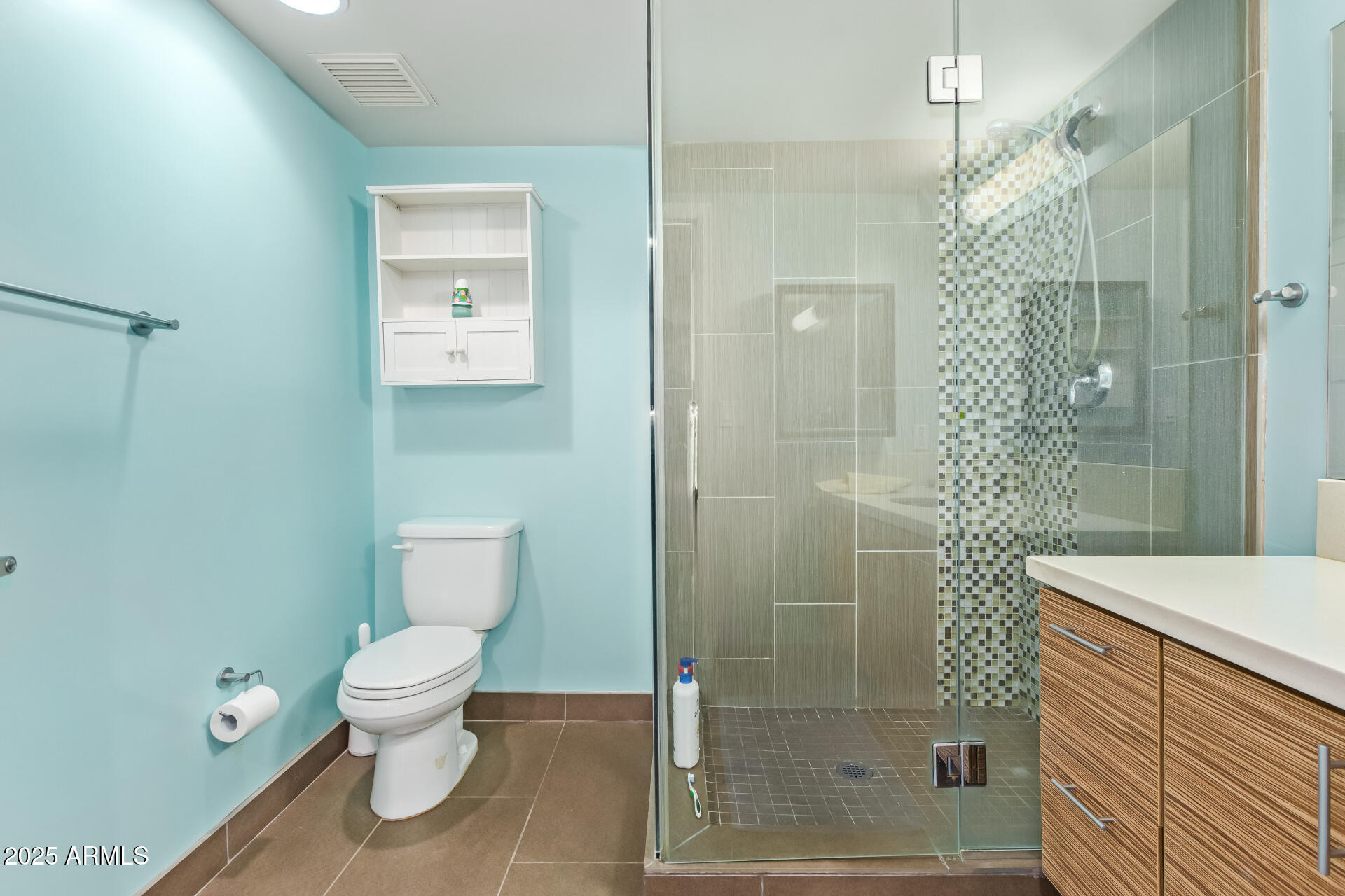 535 West Thomas Road, Unit 313 Phoenix, AZ 85013 - Photo 24 of 31 a bathroom with a shower a toilet and a sink