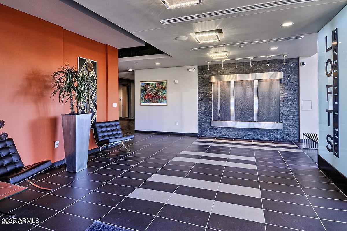 535 West Thomas Road, Unit 313 Phoenix, AZ 85013 - Photo 3 of 31 a view of entryway with a rug and a floor to ceiling window