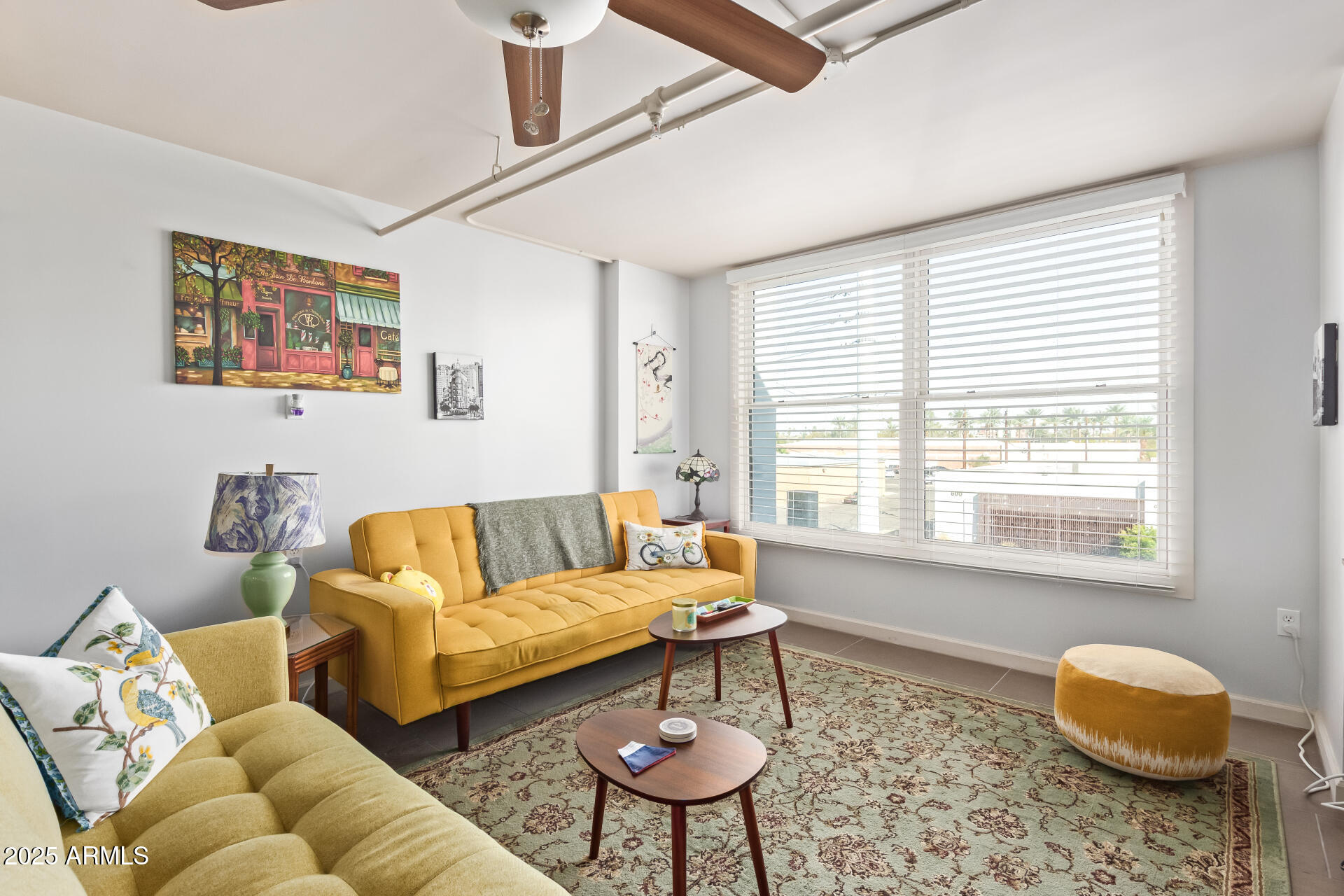 535 West Thomas Road, Unit 313 Phoenix, AZ 85013 - Photo 8 of 31 a living room with furniture and a large window