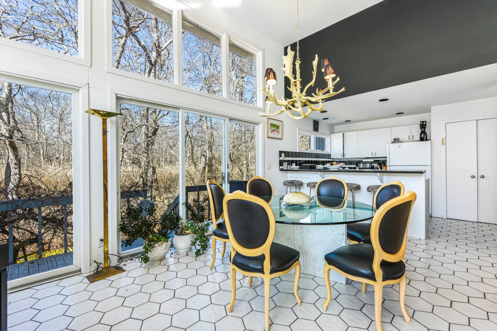 45 South Country Road Westhampton, NY 11977 - Photo 11 of 22 a kitchen with stainless steel appliances granite countertop a stove a sink and a dining table