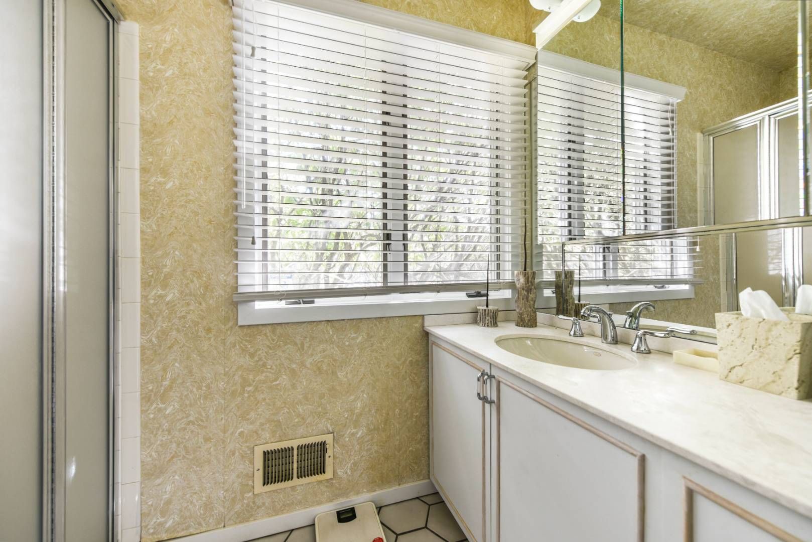45 South Country Road Westhampton, NY 11977 - Photo 17 of 22 a bathroom with a sink and a window