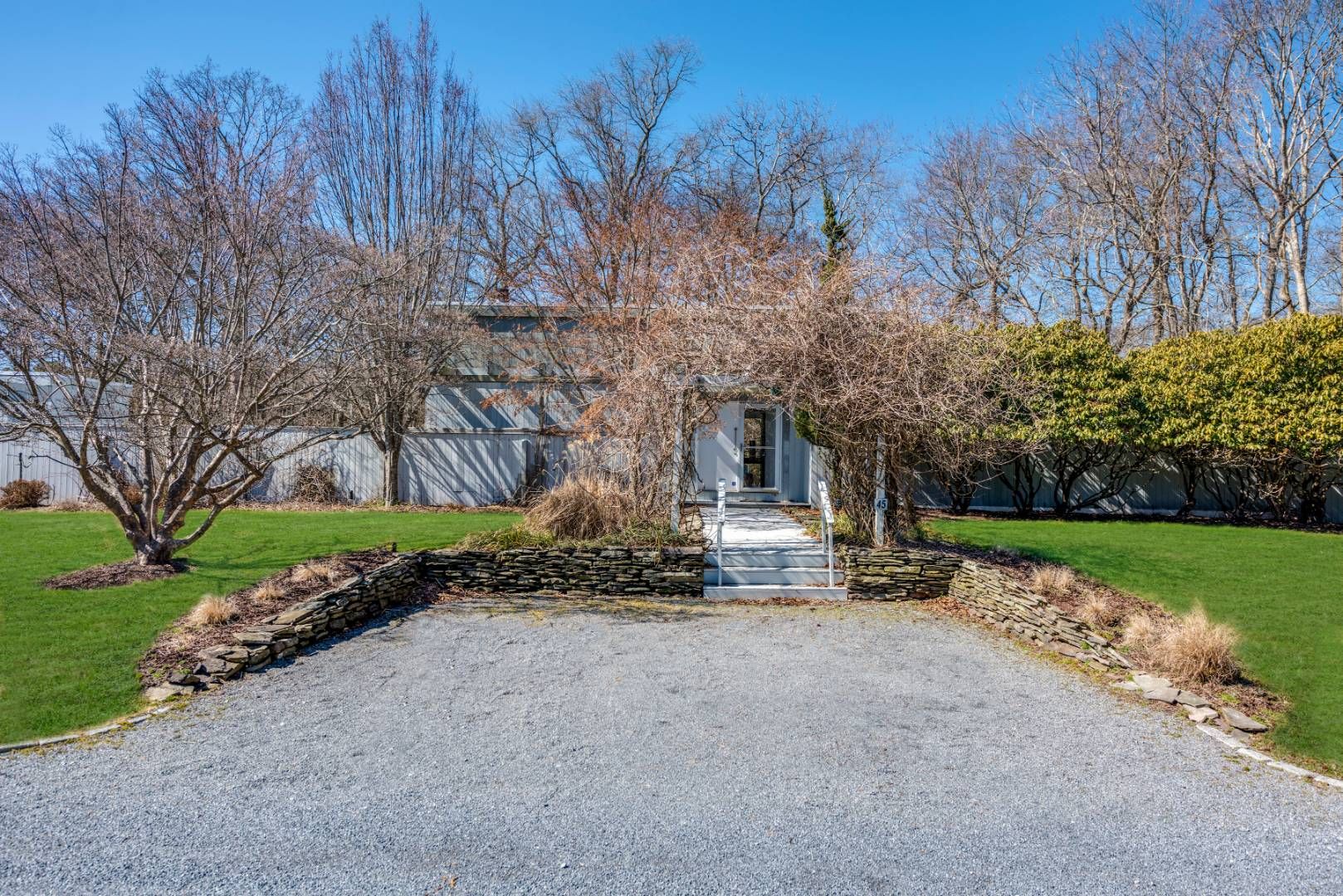 45 South Country Road Westhampton, NY 11977 - Photo 4 of 22 a view of a house with a yard and pathway