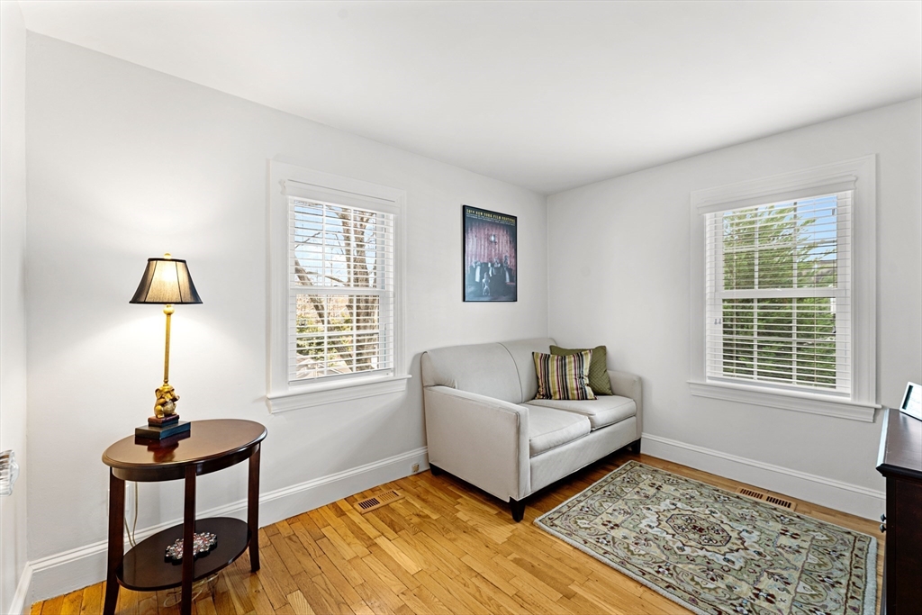 1052 Greendale Avenue Needham, MA 02492 - Photo 13 of 42 a living room with furniture and a window