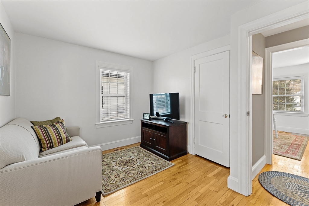 1052 Greendale Avenue Needham, MA 02492 - Photo 14 of 42 a living room with furniture and a flat screen tv