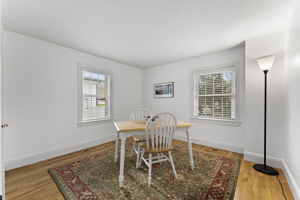 1052 Greendale Avenue Needham, MA 02492 - Photo 15 of 42 a dining room with wooden floor and a window