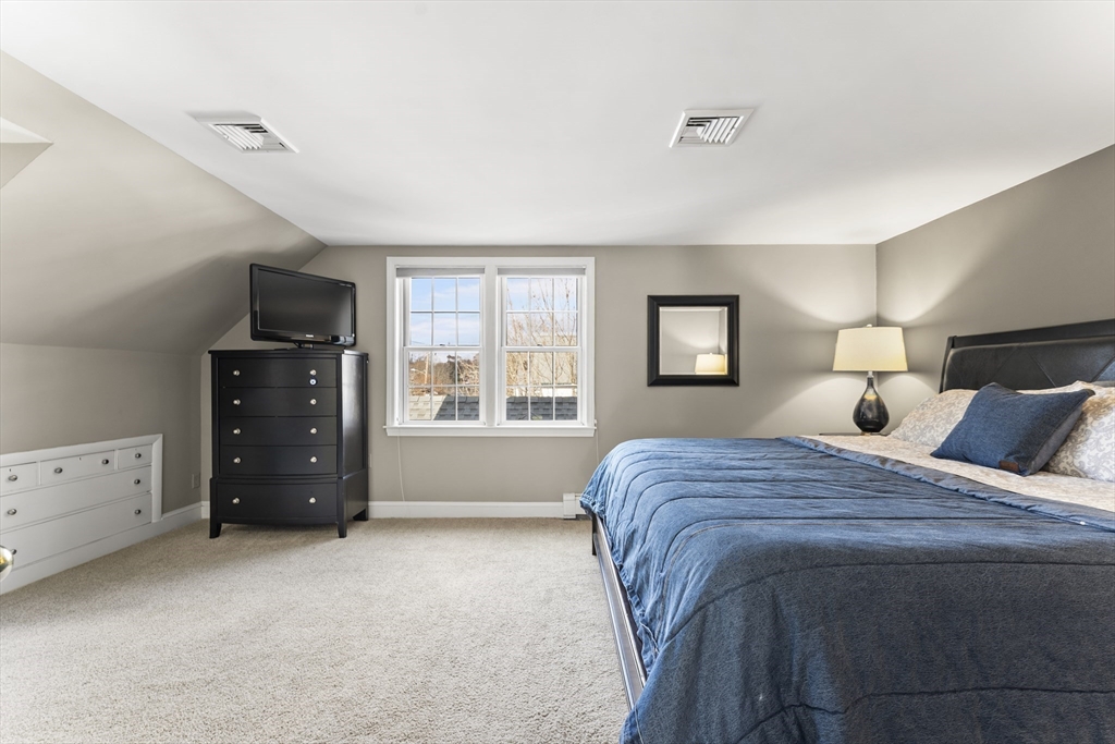 1052 Greendale Avenue Needham, MA 02492 - Photo 19 of 42 a bed room with a bed and a tv