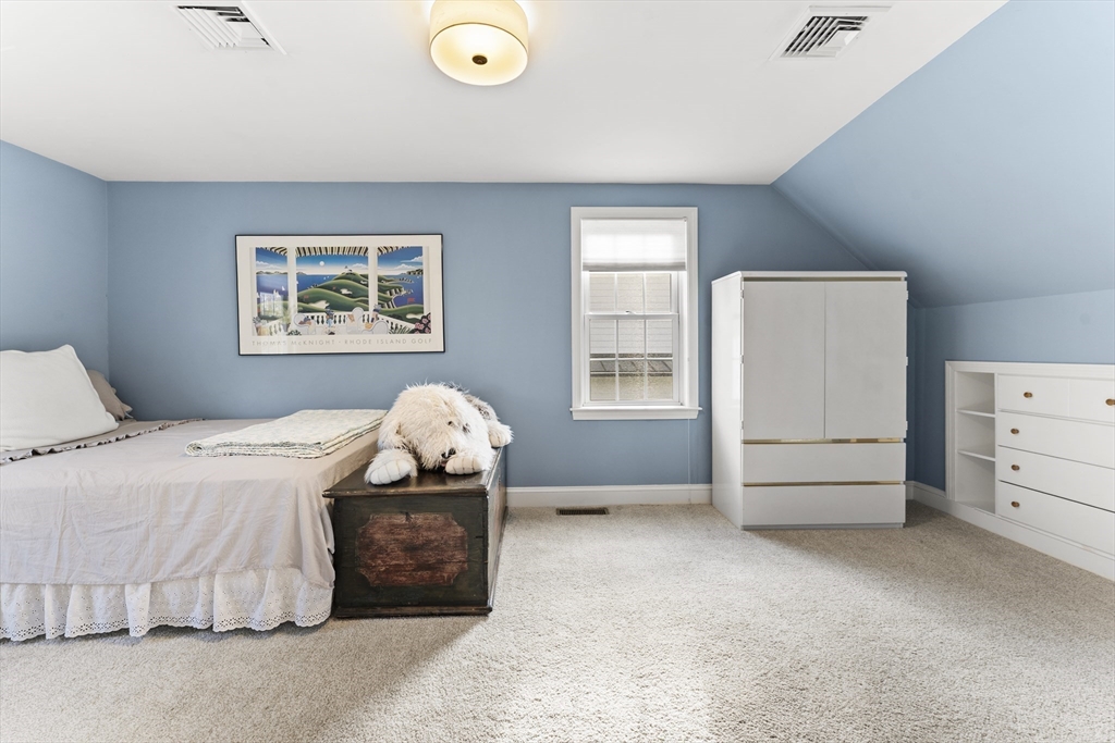 1052 Greendale Avenue Needham, MA 02492 - Photo 23 of 42 a bedroom with a bed and a window