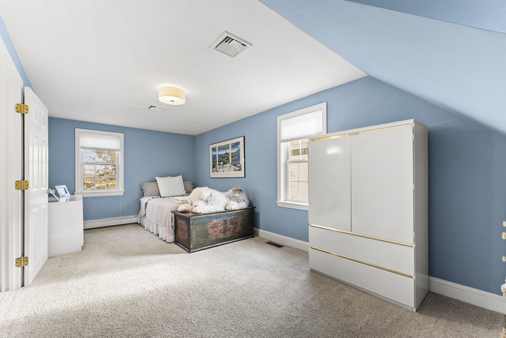 1052 Greendale Avenue Needham, MA 02492 - Photo 24 of 42 a living room with furniture and a window