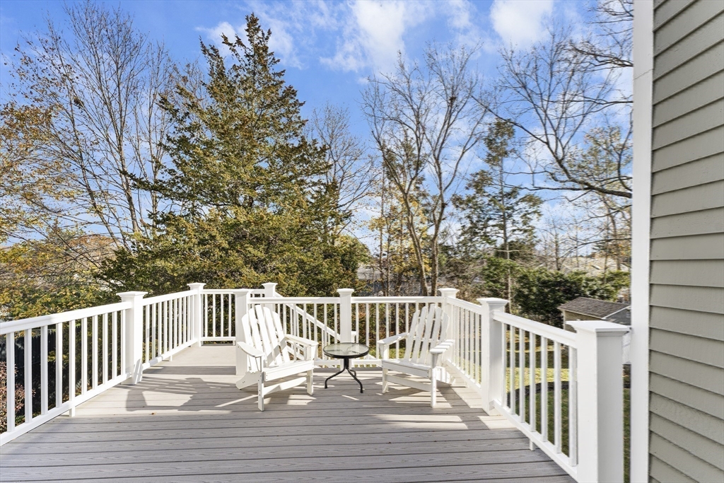 1052 Greendale Avenue Needham, MA 02492 - Photo 34 of 42 a view of balcony with wooden floor and fence