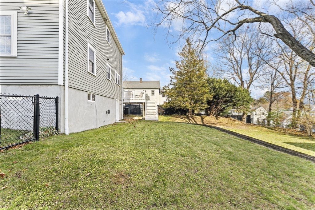 1052 Greendale Avenue Needham, MA 02492 - Photo 39 of 42 a view of a house with a yard
