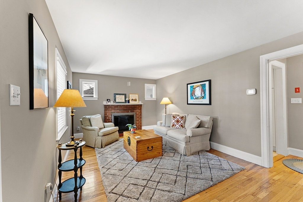 1052 Greendale Avenue Needham, MA 02492 - Photo 5 of 42 a living room with furniture and a fireplace