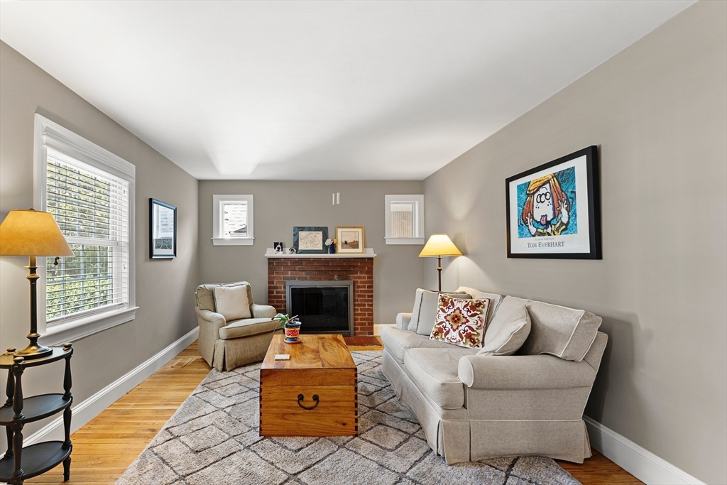 1052 Greendale Avenue Needham, MA 02492 - Photo 6 of 42 a living room with furniture a rug and a fireplace
