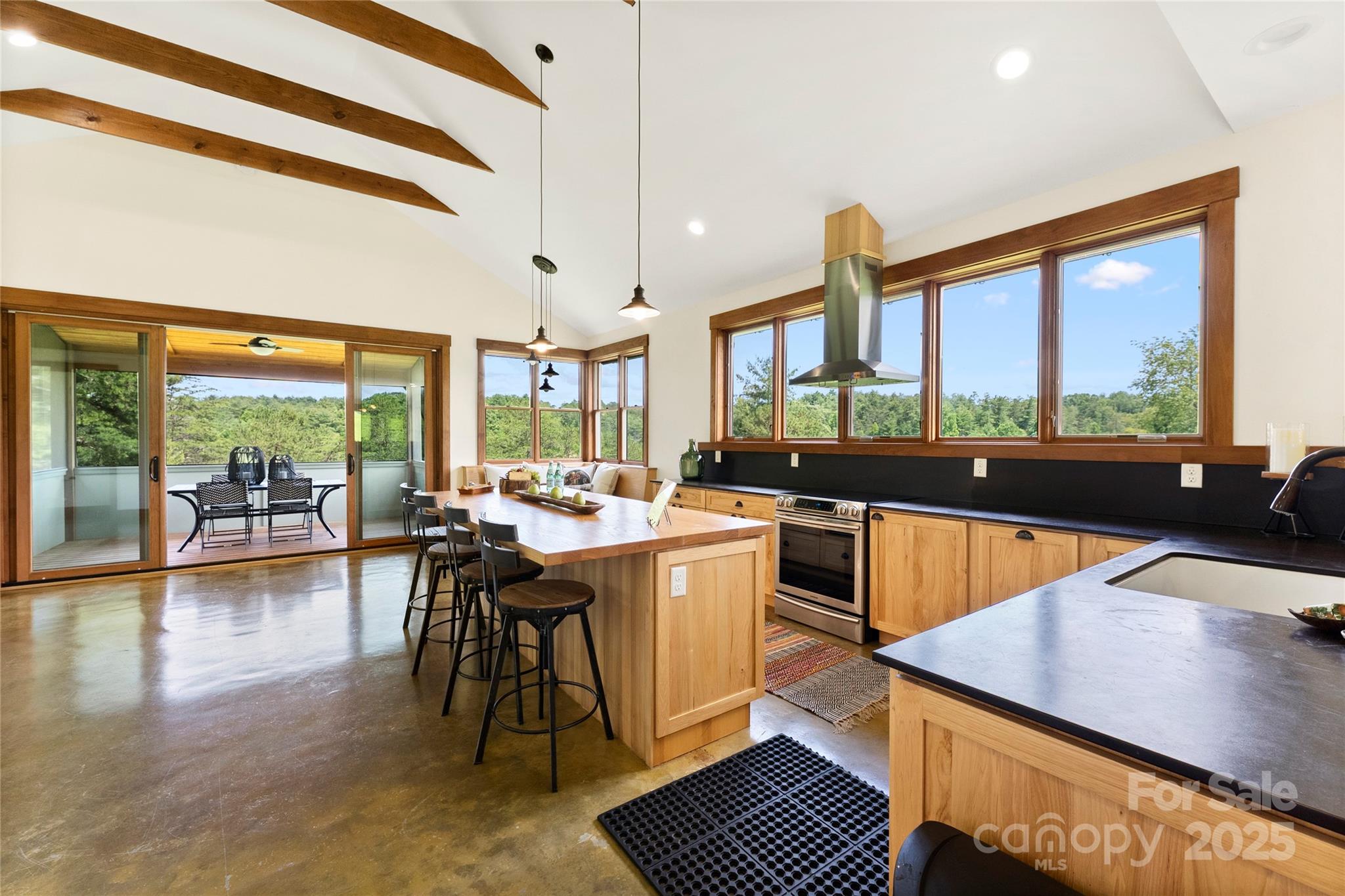 13 New Home Road Marshall, NC 28753 - Photo 13 of 48 a kitchen with a large window and dining table
