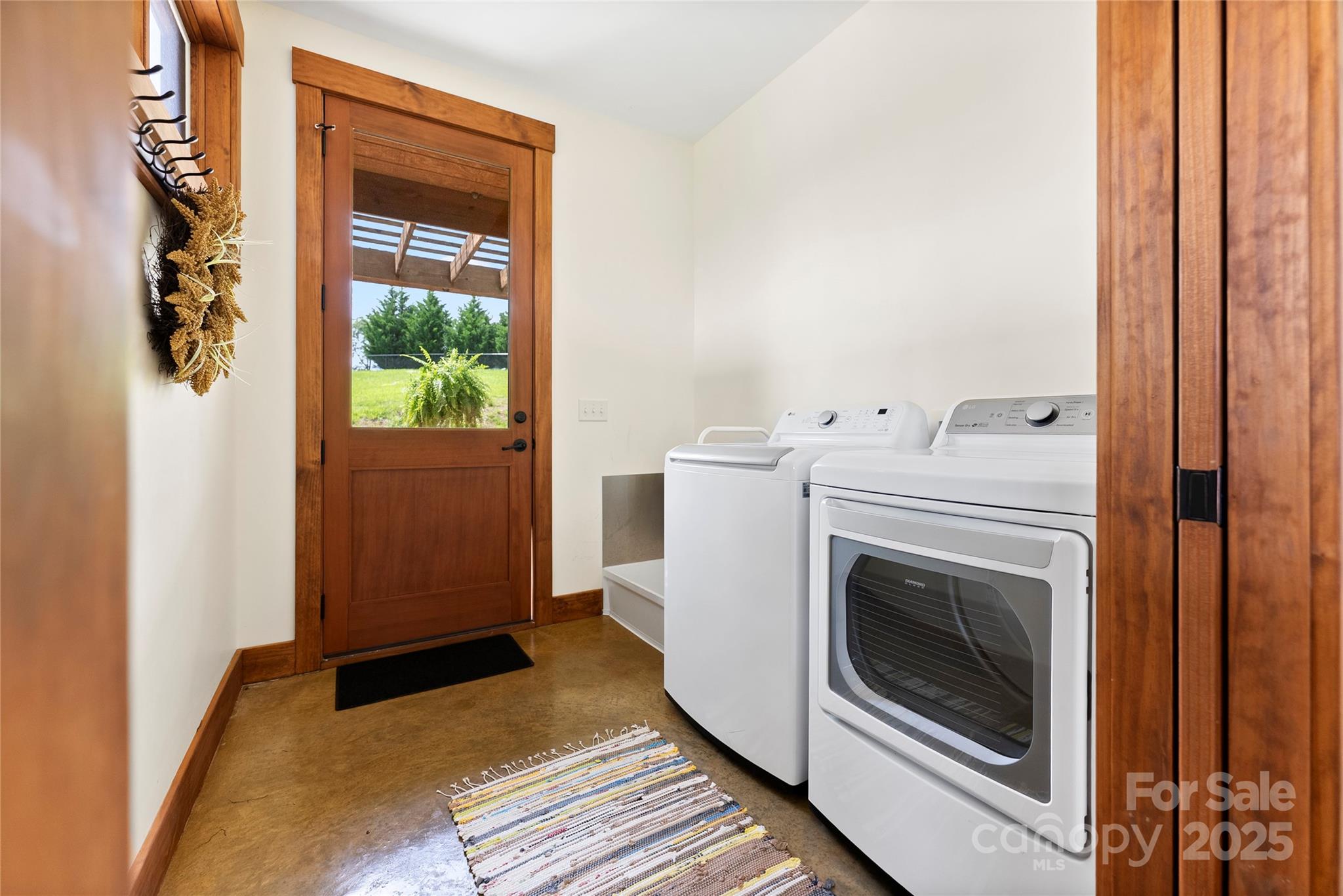 13 New Home Road Marshall, NC 28753 - Photo 23 of 48 a view of a hallway with washer and dryer