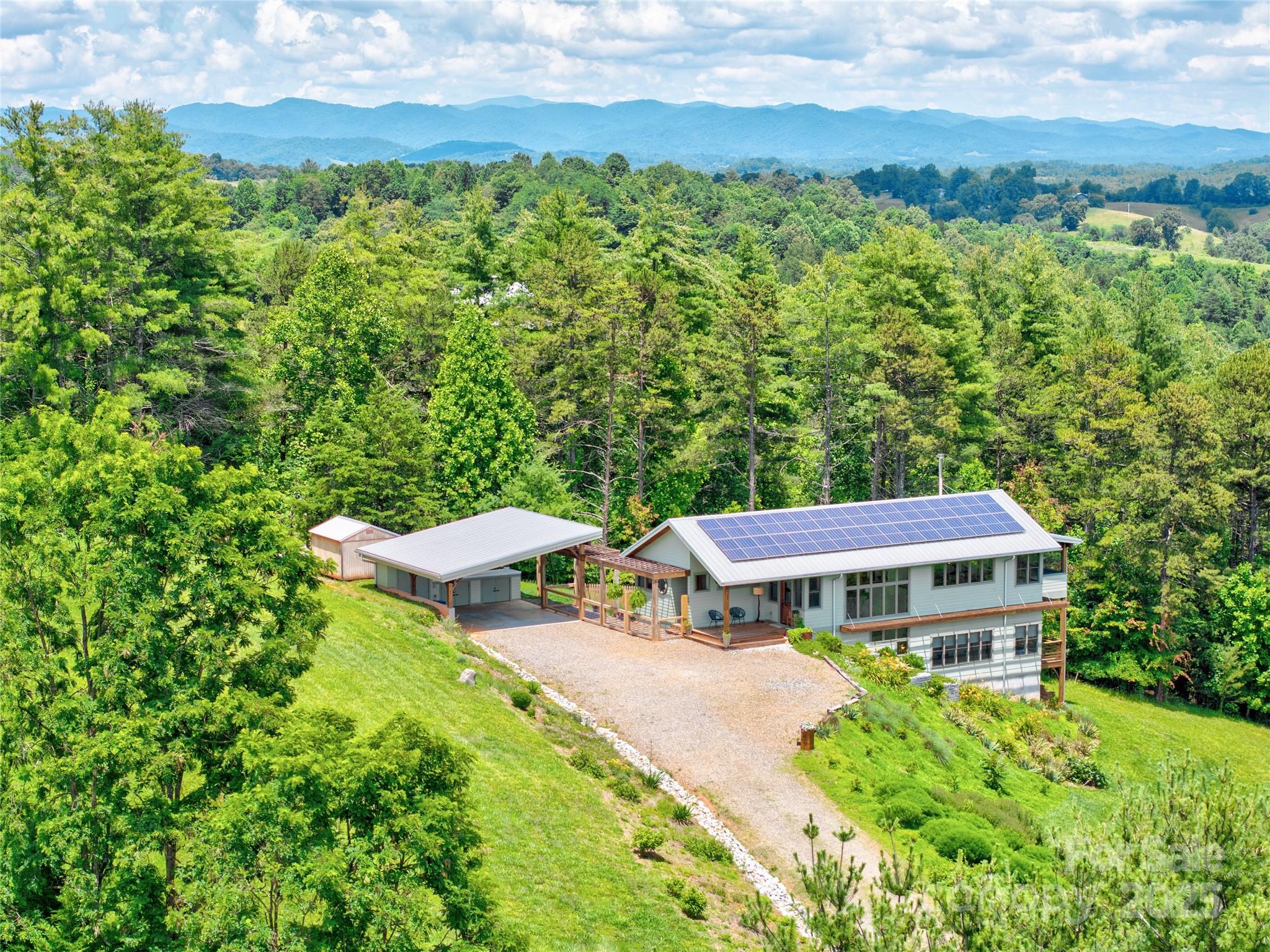13 New Home Road Marshall, NC 28753 - Photo 4 of 48 an aerial view of a house with a yard