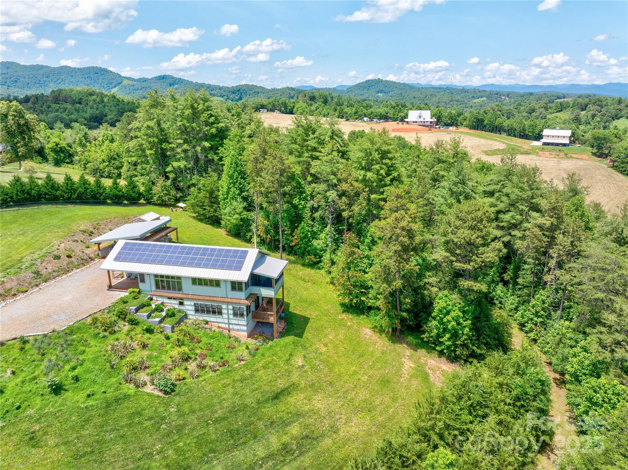 13 New Home Road Marshall, NC 28753 - Photo 48 of 48 an aerial view of a house with a garden and a yard