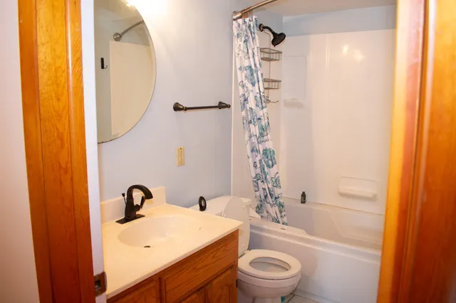 a view of front door with wooden floor
