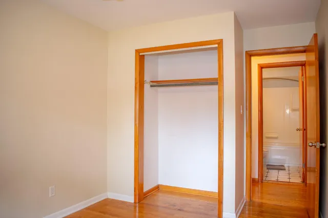 a view of walk in closet with empty tub