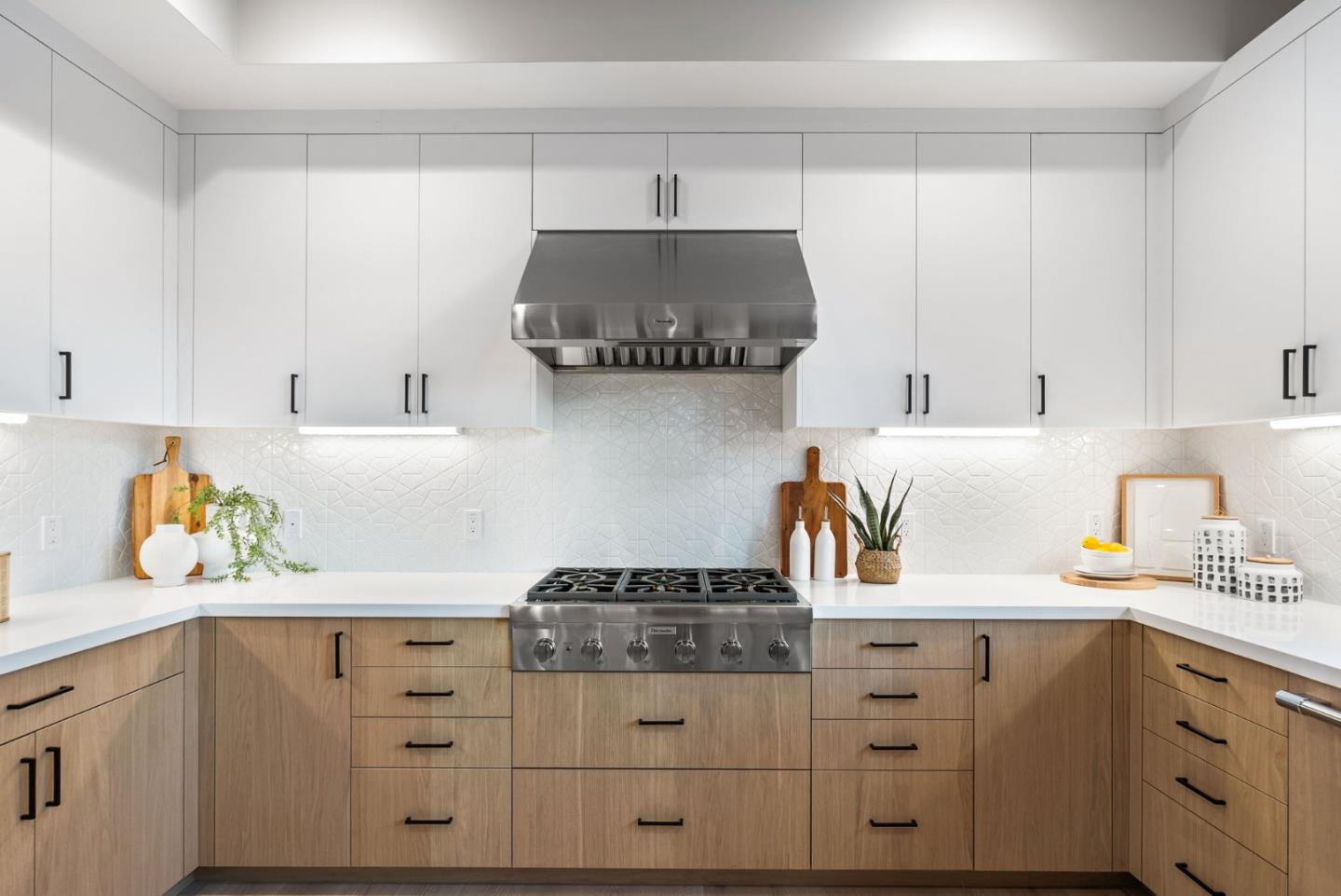 229 Hope Street Mountain View, CA 94041 - Photo 16 of 53 a kitchen with white cabinets and a stove