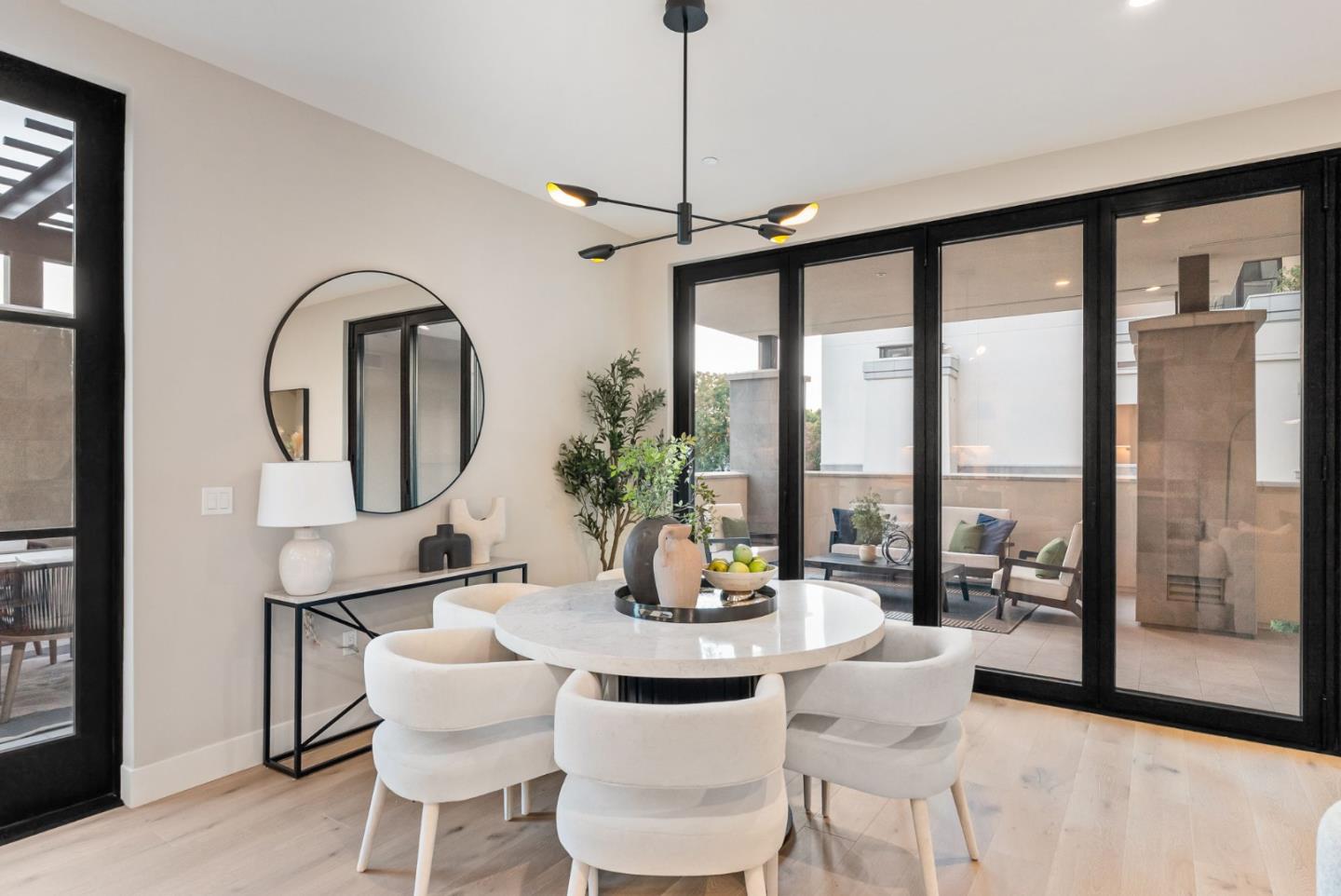 229 Hope Street Mountain View, CA 94041 - Photo 19 of 53 a dining room with furniture a chandelier and wooden floor