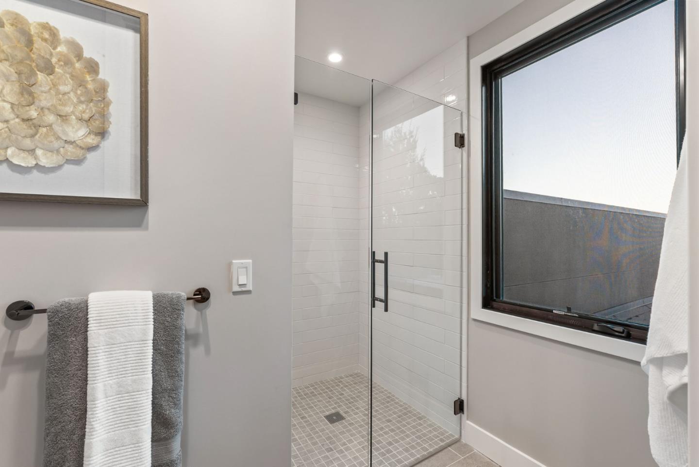 229 Hope Street Mountain View, CA 94041 - Photo 35 of 53 a bathroom with a shower and a mirror