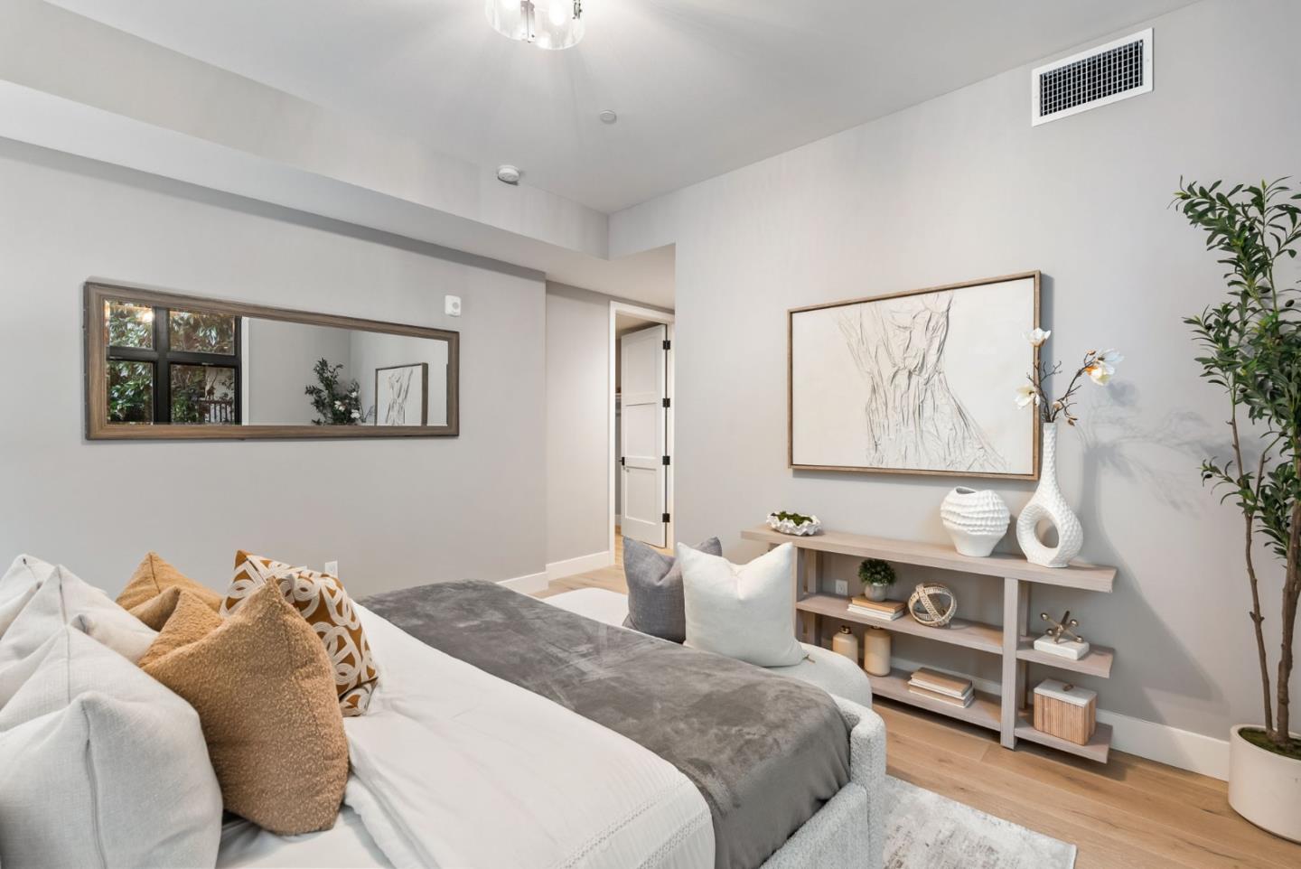 229 Hope Street Mountain View, CA 94041 - Photo 41 of 53 a bedroom with a bed and wooden floor