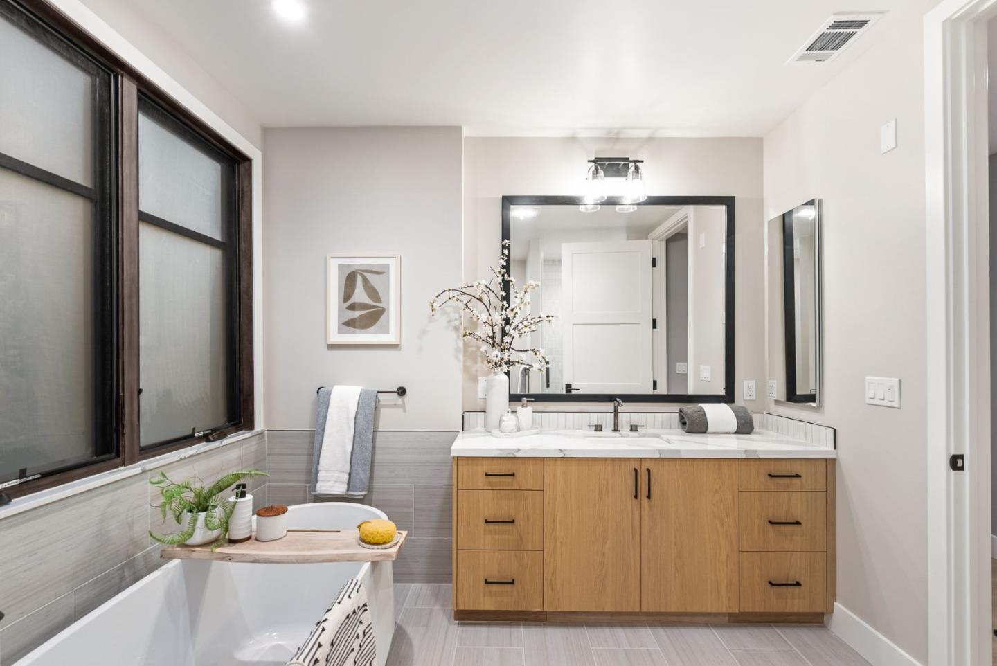 229 Hope Street Mountain View, CA 94041 - Photo 43 of 53 a bathroom with a granite countertop sink and a mirror