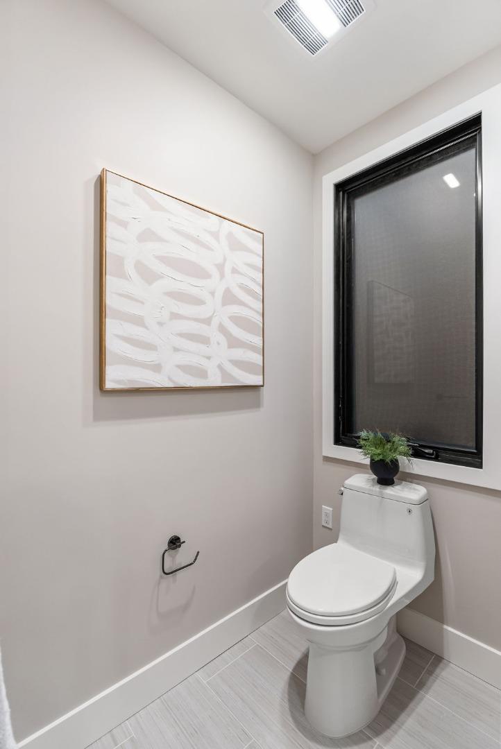 229 Hope Street Mountain View, CA 94041 - Photo 46 of 53 a bathroom with a toilet a sink and mirror