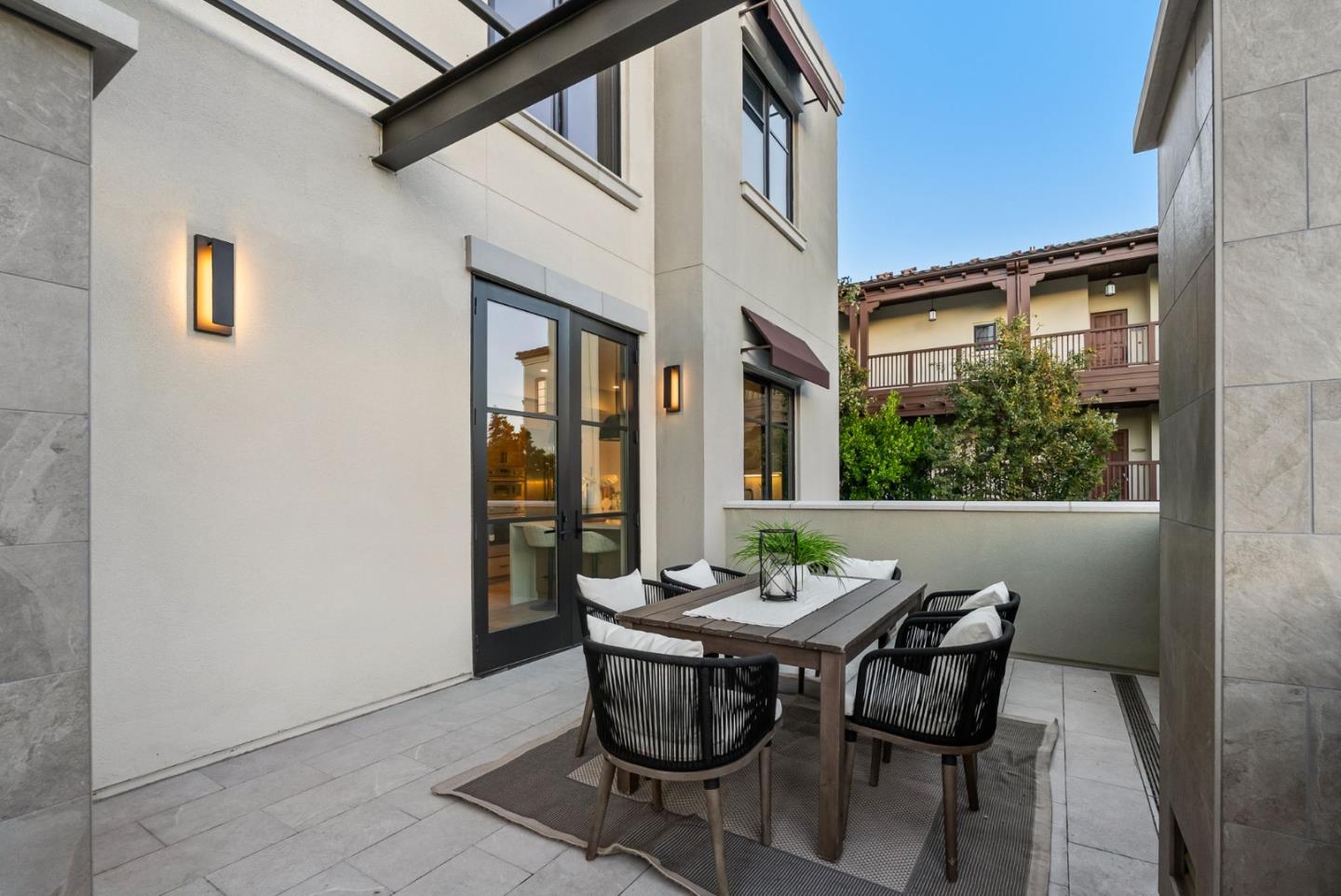 229 Hope Street Mountain View, CA 94041 - Photo 49 of 53 a view of a patio with table and chairs