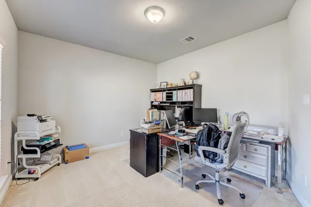 a room with furniture and air hockey table
