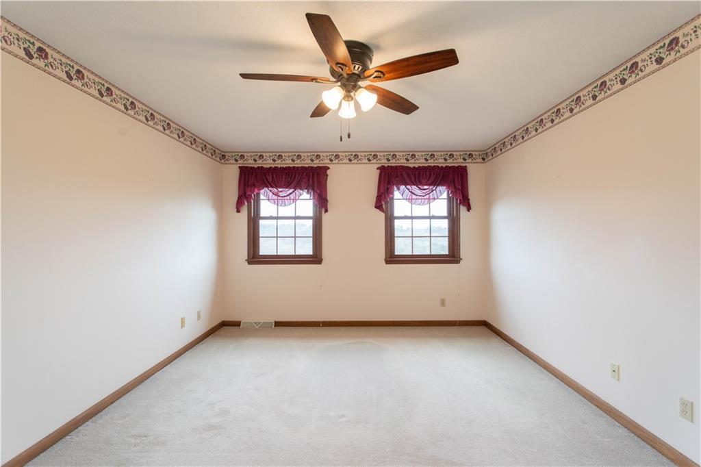 128 Moffett Run Road Aliquippa, PA 15001 - Photo 31 of 48 an empty room with windows and fan