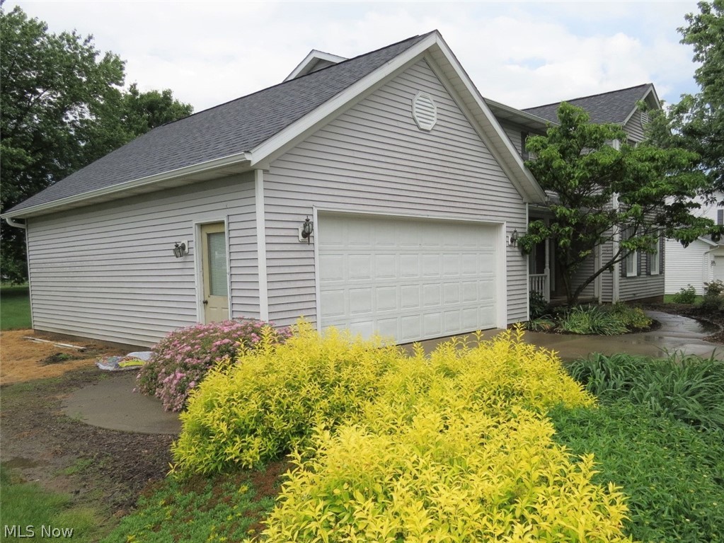 1305 Eastern Road Rittman, OH 44270 - Photo 19 of 26 Two Car Garage with a Workbench Area and Storage For Those Tools.