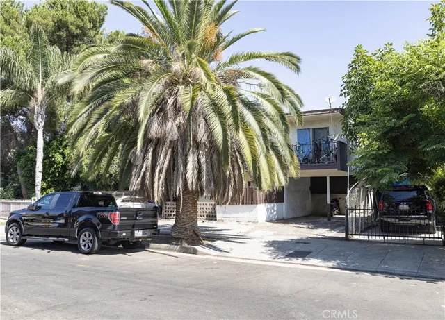 a view of a car park in front of a house